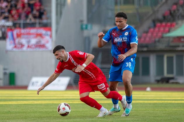 GER, Erfurt, Fussball, Regionalliga Nordost, 3. Spieltag, FC Rot-Weiss Erfurt vs. Tasmania Berlin im Bild v.l.: Stanislav Fehler (FC Rot-Weiß Erfurt 11), Zweikampf 05.08.2026, Steigerwaldstadion Erfurt DFB REGULATIONS PROHIBIT ANY USE OF PHOTOGRAPHS AS IMAGE SEQUENCES AND OR QUASI-VIDEO, *** GER, Erfurt, Soccer, Northeast Regional League, Matchday 3, FC Rot Weiss Erfurt vs. Tasmania Berlin (pictured, from left): Stanislav Fehler (FC Rot Weiss Erfurt, No. 11), tackle, August 5, 2026, Steigerwaldstadion, Erfurt. DFB regulations prohibit any use of photographs as image sequences and or quasi-video, Copyright: HMBxMedia PaulxFritz