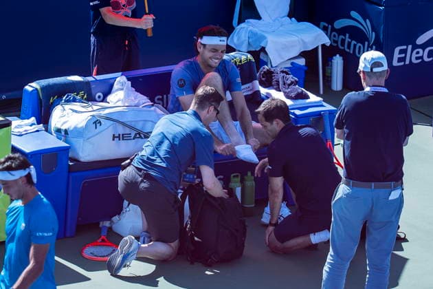 August 5, 2026, Montreal, Pq, Canada: Taylor Fritz of the United States is attended to by medical staff during a match against Thiago Agustin Tirante of Argentina on day four of the National Bank Open tennis tournament in Montreal on Wednesday, August 5, 2026. Canada News - August 5, 2026  - ZUMAc35_ 20260805_zaf_c35_136 Copyright: xChristopherxKatsarovx