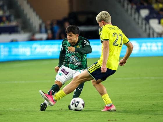 August 5, 2026: Club Leon defender Ivan Moreno (7) is tackled by Nashville SC midfielder Reed Baker-Whiting (27) during a Leagues Cup match between Leon and Nashville SC at Geodis Park in Nashville, TN. CSM Nashville United States of America - ZUMAc04_ 20260805_zma_c04_068 Copyright: xStephenxFurstx