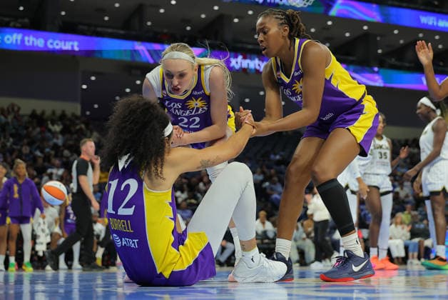 CHICAGO, IL - AUGUST 05: Rae Burrell 12 of the Los Angeles Sparks is helped by Cameron Brink 22 of the Los Angeles Sparks and Ariel Atkins 7 of the Los Angeles Sparks during the second half on August 5, 2026 at Wintrust Arena in Chicago, Illinois. (Photo by Melissa Tamez Icon Sportswire) WNBA, Basketball Damen, USA AUG 05 Los Angeles Sparks at Chicago Sky EDITORIAL USE ONLY Icon260805019