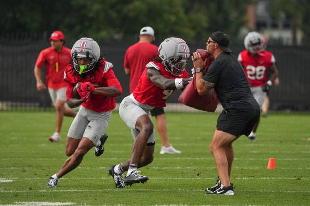 COLUMBUS, OH - AUGUST 06: Jeremiah Smith 4 of the Ohio State Buckeyes blocks while Chris Henry Jr. 15 of the Ohio State Buckeyes runs a route during fall camp held at the Woody Hayes Athletic Center on August 6, 2026 in Columbus, Ohio (Photo by Jason Mowry Icon Sportswire) COLLEGE FOOTBALL: AUG 06 Ohio State Fall Camp EDITORIAL USE ONLY Icon260806022