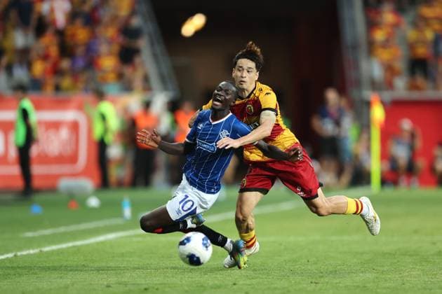 Yuki Kobayashi of Jagiellonia Bialystok fouls Mohamed Diomande of Rangers during the UEFA Europa League third qualifying round first leg match at Chorten Arena, Bialystok. Jagiellonia Bialystok v Rangers - UEFA Europa League 3rd Round Qualifying - Chorten Arena, Lanarkshire, Poland - 06 Aug 2026Bialystok Chorten Arena Lanarkshire Poland EDITORIAL USE ONLY  Copyright: xRangersxFC Shutterstockx 17051216fs