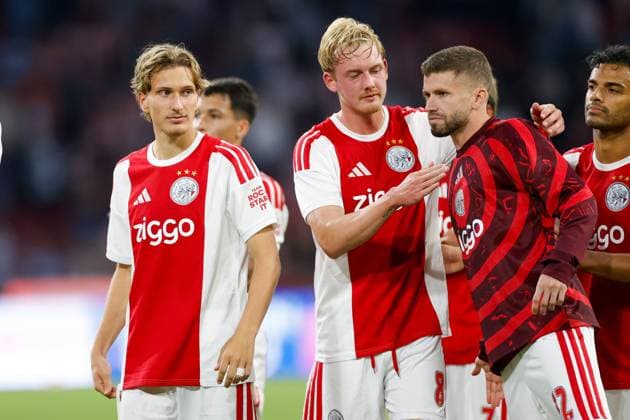 AMSTERDAM , 06-08-2026, Johan Cruijff ArenA , season 2026 2027 , UEFA Conference League play-off football . Match between Ajax and Shelbourne FC , Picture shows Ajax player Mika Godts, Ajax player Julian Brandt, Ajax player Caio Henrique Ajax - Shelbourne  x205491454x Copyright: