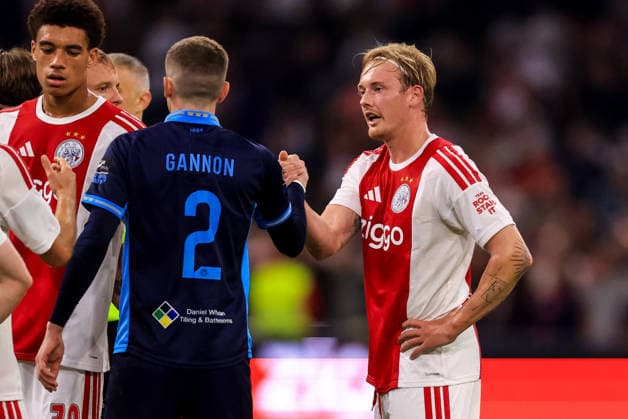 AMSTERDAM, NETHERLANDS - AUGUST 6: Sean Gannon of Shelbourne FC and Julian Brandt of AFC Ajax shake hands after the UEFA Conference League 2026 27 third qualifying round first leg match between AFC Ajax and Shelbourne FC at the Johan Cruijff Arena on August 6, 2026 in Amsterdam, Netherlands.  Copyright: xRenexNijhuis MBxMediax