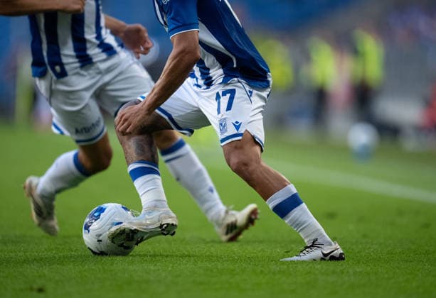 Cropped dribbling legs of Allahyar Sayyadmanesh of Lech Poznan seen during UEFA Conference League - Third Qualifying Round season 26 27 match between teams of Lech Poznan and KI Klaksvik (Ruslan Taran Ball Raw Images) Poznan Enea Stadion Poland Copyright: xRuslanxTaranx RUS_LPOvKLA-0097