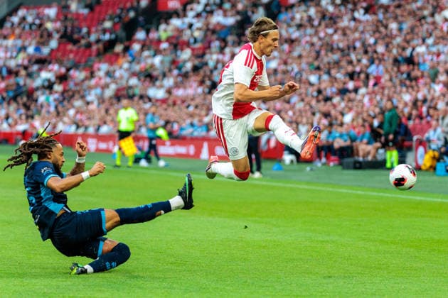 AFC Ajax v Shelbourne FC - UEFA Conference League AMSTERDAM, NETHERLANDS - AUGUST 6: Mika Godts of AFC Ajax and Milan Mbeng of Shelbourne FC during the UEFA Conference League match between AFC Ajax and Shelbourne FC at Johan Cruijff Arena on August 6, 2026 in Amsterdam, Netherlands. Amsterdam Johan Cruijff Arena Netherlands Content not available for redistribution in The Netherlands directly or indirectly through any third parties. Copyright: xMarcelxvanxPlateringenx