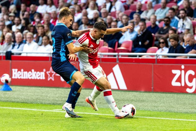 AFC Ajax v Shelbourne FC - UEFA Conference League AMSTERDAM, NETHERLANDS - AUGUST 6: Oscar Gloukh of AFC Ajax and James Norris of Shelbourne FC during the UEFA Conference League match between AFC Ajax and Shelbourne FC at Johan Cruijff Arena on August 6, 2026 in Amsterdam, Netherlands. Amsterdam Johan Cruijff Arena Netherlands Content not available for redistribution in The Netherlands directly or indirectly through any third parties. Copyright: xMarcelxvanxPlateringenx