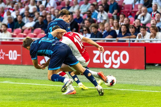 AFC Ajax v Shelbourne FC - UEFA Conference League AMSTERDAM, NETHERLANDS - AUGUST 6: Oscar Gloukh of AFC Ajax and James Norris and Daniel Kelly of Shelbourne FC during the UEFA Conference League match between AFC Ajax and Shelbourne FC at Johan Cruijff Arena on August 6, 2026 in Amsterdam, Netherlands. Amsterdam Johan Cruijff Arena Netherlands Content not available for redistribution in The Netherlands directly or indirectly through any third parties. Copyright: xMarcelxvanxPlateringenx