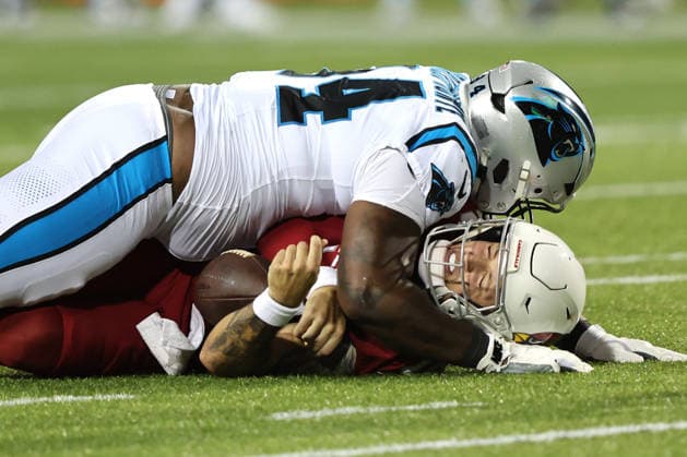 Arizona Cardinals quarterback Carson Beck (19) is sacked by Carolina Panthers Jared Harrison-Hunte (94) during the second quarter of their preseason game at the Pro Football Hall of Fame Game in Canton, Ohio, on Thursday, August 6, 2026.  CAN20260806118 AARONxJOSEFCZYK