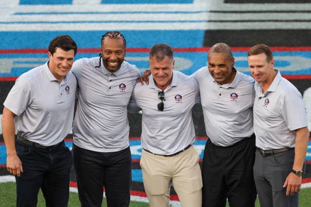CANTON, OH - AUGUST 06: The 2026 Pro Football Hall of Fame Class of 2026 Luke Kuechly, Larry Fitzgerald, Adam Vinatieri, Roger Craig and Drew Brees pose for a photo prior to the National Football League preseason game between the Carolina Panthers and Arizona Cardinals on August 6, 2026, at the Tom Benson Hall of Fame Stadium in Canton, OH. (Photo by Frank Jansky Icon Sportswire) NFL, American Football Herren, USA AUG 06 Hall of Fame Game - Panthers vs Cardinals EDITORIAL USE ONLY Icon26080601