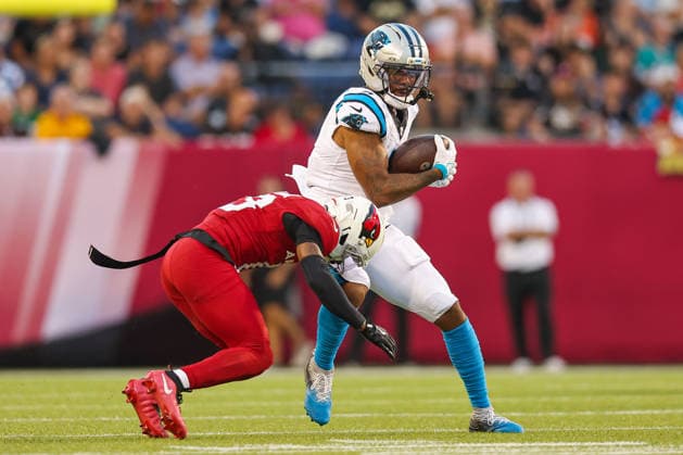 August 6, 2026, Canton, Ohio, USA: Carolina Panthers player attempts to escape a tackle form Arizona Cardinals player at the 2026 Pro Football Hall of Fame Game between the Carolina Panthers and Arizona Cardinals at Tom Benson Hall of Fame Stadium on August 6, 2026 in Canton, Ohio. NFL, American Football Herren, USA 2026: Hall Of Fame Game - Carolina Panthers Vs. Arizona Cardinals - NFL Preseason 2026  - ZUMAs335 20260806_znp_s335_021 Copyright: xMatthewxSmithx
