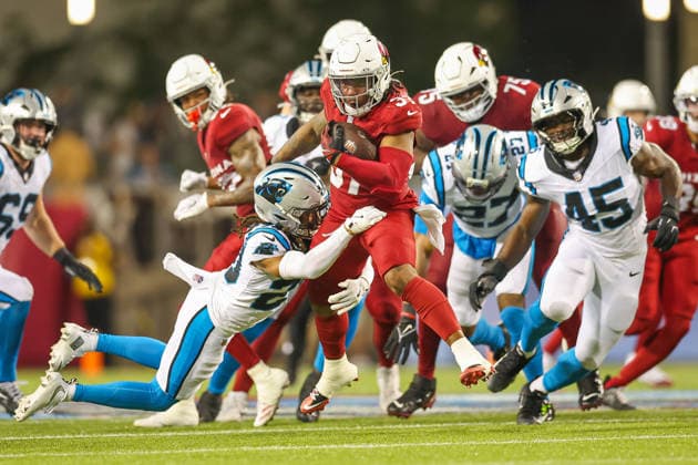 August 6, 2026, Canton, Ohio, USA: Arizona Cardinals player attempts to escape Carolina Panthers defense at the 2026 Pro Football Hall of Fame Game between the Carolina Panthers and Arizona Cardinals at Tom Benson Hall of Fame Stadium on August 6, 2026 in Canton, Ohio. Canton USA - ZUMAs335 20260806_znp_s335_037 Copyright: xMatthewxSmithx