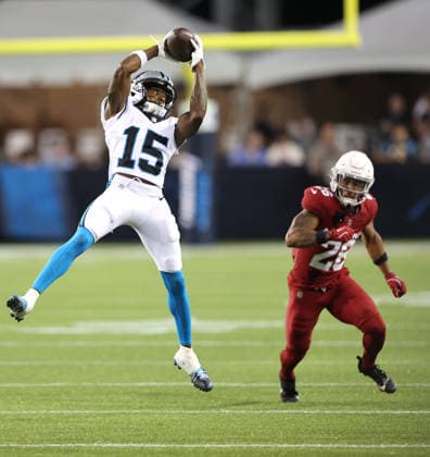 Carolina Panthers Jimmy Horn Jr.(15) makes a catch in front of Arizona Cardinals Elijah Culp (26) the third quarter of the Pro Football Hall of Fame Game in Canton, Ohio, on Thursday, August 6, 2026.  CAN20260806128 AARONxJOSEFCZYK