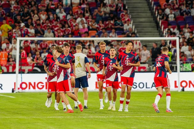 HONG KONG-SPORTS BAYERN-ASTON-VILLA Players of Bayern Munich and Aston Villa warm up on the pitch at the Kai Tak Stadium prior to their exhibition football match on August 7, 2026 in Hong Kong. The highly anticipated match attracted enthusiastic local and overseas fans to support their favourite clubs. (Photo by Zulu Lo TMHK via Nexpher Images) Hong Kong