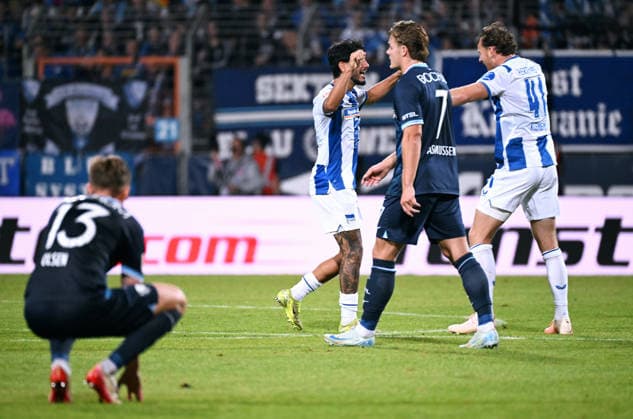 Bochum, Germany, 2. Bundesliga, Matchday 1, Vonovia Ruhrstadion Bochum, VfL Bochum vs Hertha BSC Berlin 0:1; OLiver Olsen (BOC), Christian Rasmussen (BOC) disappointed after the match, Pascal Klemens (HBB) celebrates. Celebration, Joy, Action, Disappointment, Frustration. *** Bochum, Germany, 2. Bundesliga, Matchday 1, Vonovia Ruhrstadion Bochum, VfL Bochum vs. Hertha BSC Berlin 0–1 (Oliver Olsen BOC), Christian Rasmussen BOC disappointed after the match, Pascal Klemens HBB celebrates; Celebration, Joy, Action, Disappointment, Frustration