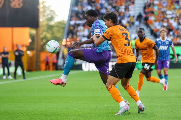 Wolverhampton Wanderers v Port Vale - Carabao Cup First Round Jaheim Headley of Port Vale FC and Hugo Bueno of Wolverhampton Wanderers battle for possession during the Carabao Cup First Round match between Wolverhampton Wanderers and Port Vale at Molineux, Wolverhampton. Wolverhampton West Midlands United Kingdom  Copyright: xMIxNewsx originalFilename:fletcher-wolverha260807_npTCi.jpg