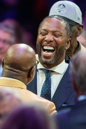 2026 Pro Football Hall of Fame Enshrinement - Gold Jacket Dinner New Enshrinee Larry Fitzgerald greets Gold Jacket Mike Singletary during the 2026 Pro Football Hall of Fame Gold Jacket Dinner at Canton Memorial Civic Center in Canton, Ohio on August 7. (Max Siker Image of Canton Ohio United States EDITORIAL USE ONLY Copyright: xImagexofxSportx MaxxSikerx iosphotos417427