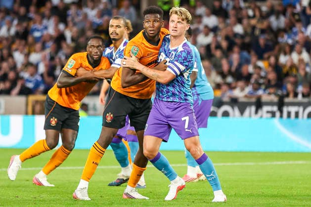 Wolverhampton Wanderers v Port Vale - Carabao Cup First Round Yerson Mosquera of Wolverhampton Wanderers and George Byers of Port Vale FC jostle for position during the Carabao Cup First Round match between Wolverhampton Wanderers and Port Vale at Molineux in Wolverhampton, United Kingdom. Wolverhampton West Midlands United Kingdom  Copyright: xMIxNewsx originalFilename:fletcher-wolverha260807_npRAP.jpg