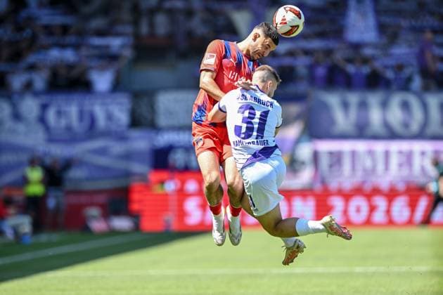 Oualid Mhamdi (1. FC Heidenheim 1846) und Patrick Kammerbauer (VfL Osnabrueck) im Zweikampf waehrend des spiels der 2. Bundesliga zwischen 1. FC Heidenheim und VfL Osnabrueck, Voith-Arena am 08. August 2026 in Heidenheim an der Brenz, Deutschland. (Foto von Harry Langer DeFodi Images) +++ Oualid Mhamdi (1. FC Heidenheim 1846) und Patrick Kammerbauer (VfL Osnabrueck) battle for the ball during the 2nd Bundesliga match between 1. FC Heidenheim and VfL Osnabrueck at Voith-Arena on August 8, 2026 in Heidenheim an der Brenz, Germany. (Photo by Harry Langer DeFodi Images) DFB DFL REGULATIONS PROHIBIT ANY USE OF PHOTOGRAPHS AS IMAGE SEQUENCES AND OR QUASI-VIDEO. (Photo by Harry Langer DeFodi Images) DFB DFL REGULATIONS PROHIBIT ANY USE OF PHOTOGRAPHS AS IMAGE SEQUENCES AND OR QUASI-VIDEO. - *** Oualid Mhamdi of 1 FC Heidenheim 1846 and Patrick Kammerbauer of VfL Osnabrück in a tackle during the 2. Bundesliga match between 1 FC Heidenheim and VfL Osnabrück, at the Voith Arena on August 8, 2026, in Heidenheim an der Brenz, Germany. Photo by Harry Langer, DeFodi Images. Oualid Mhamdi of 1 FC Heidenheim 1846 and Patrick Kammerbauer of VfL Osnabrück battle for the ball during the 2. Bundesliga match between 1 FC Heidenheim and VfL Osnabrück at Voith Arena on August 8, 2026 in Heidenheim an der Brenz, Germany Photo by Harry Langer, DeFodi Images. DFB and DFL regulations prohibit any use of photographs as image sequences and or quasi-video. Photo by Harry Langer, DeFodi Images. DFB and DFL regulations prohibit any use of photographs as imSEQUENCES AND OR QUASI-VIDEO