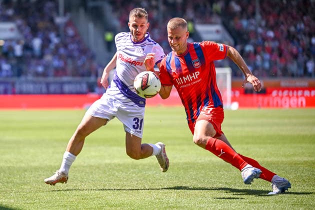 Patrick Kammerbauer (VfL Osnabrueck) und Adrian Beck (1. FC Heidenheim 1846) im Zweikampf waehrend des spiels der 2. Bundesliga zwischen 1. FC Heidenheim und VfL Osnabrueck, Voith-Arena am 08. August 2026 in Heidenheim an der Brenz, Deutschland. (Foto von Harry Langer DeFodi Images) +++ Patrick Kammerbauer (VfL Osnabrueck) und Adrian Beck (1. FC Heidenheim 1846) battle for the ball during the 2nd Bundesliga match between 1. FC Heidenheim and VfL Osnabrueck at Voith-Arena on August 8, 2026 in Heidenheim an der Brenz, Germany. (Photo by Harry Langer DeFodi Images) DFB DFL REGULATIONS PROHIBIT ANY USE OF PHOTOGRAPHS AS IMAGE SEQUENCES AND OR QUASI-VIDEO. (Photo by Harry Langer DeFodi Images) DFB DFL REGULATIONS PROHIBIT ANY USE OF PHOTOGRAPHS AS IMAGE SEQUENCES AND OR QUASI-VIDEO. - *** Patrick Kammerbauer of VfL Osnabrück and Adrian Beck of 1 FC Heidenheim 1846 go head-to-head during the 2. Bundesliga match between 1 FC Heidenheim and VfL Osnabrück, at the Voith Arena on August 8, 2026, in Heidenheim an der Brenz, Germany. Photo by Harry Langer, DeFodi Images. Patrick Kammerbauer of VfL Osnabrück and Adrian Beck of 1 FC Heidenheim 1846 battle for the ball during the 2. Bundesliga match between 1 FC Heidenheim and VfL Osnabrück at Voith Arena on August 8, 2026 in Heidenheim an der Brenz, Germany. Photo by Harry Langer, DeFodi Images. DFB and DFL regulations prohibit any use of photographs as image sequences and or quasi-video. Photo by Harry Langer, DeFodi Images. DFB and DFL regulations prohibit any use of photographs as imSEQUENCES AND OR QUASI-VIDEO