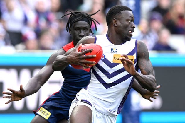 AFL DEMONS DOCKERS, Michael Frederick of the Dockers in action ahead of Changkuoth Jiath of the Demons during the AFL Round 22 match between the Melbourne Demons and the Fremantle Dockers at the Melbourne Cricket Ground in Melbourne, Saturday, August 8, 2026. ( NO ARCHIVING, EDITORIAL USE ONLY MELBOURNE VICTORIA AUSTRALIA  Copyright: xADAMxTRAFFORDx 20260809123348389710