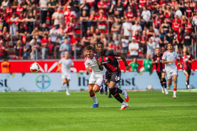 Kike Salas (FC Sevilla, 04) im Laufdeull mit Christian Kofane (Bayer 04 Leverkusen, 35) um den Ball Bayer 04 Leverkusen vs. FC Sevilla, Fussball, Saisoneroeffnungspiel, Freundschaftsspiel, Saison 2026 27, 08.08.2026, DFL REGULATIONS PROHIBIT ANY USE OF PHOTOGRAPHS AS IMAGE SEQUENCES AND OR QUASI-VIDEO, Bayer 04 Leverkusen vs. FC Sevilla, Fussball, Saisoneroeffnungsspiel, Freundschaftsspiel, Saison 2026 27, 08.08.2026 Leverkusen *** Kike Salas (FC Sevilla), No. 04, in a footrace with Christian Kofane (Bayer 04 Leverkusen), No. 35, for the ball; Bayer 04 Leverkusen vs. FC Sevilla, soccer, season opener, friendly match, 2026–27 season, August 8, 2026, DFL regulations prohibit any use of photographs as image sequences and or quasi-video, Bayer 04 Leverkusen vs. FC Sevilla, soccer, season opener, friendly match, 2026–27 season, August 8, 2026, Leverkusen Copyright: xEibner-Pressefoto LukasxBaldygax EP_LBA