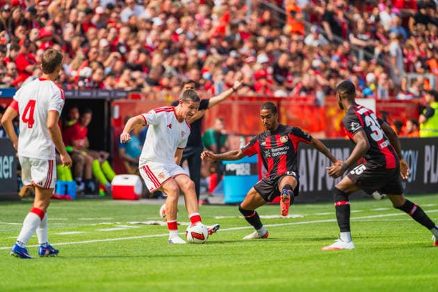 Kike Salas (FC Sevilla, 04), Oso (FC Sevilla, 36) passt und wird angegriffen von Arthur (Bayer 04 Leverkusen, 13), Christian Kofane (Bayer 04 Leverkusen, 35) Bayer 04 Leverkusen vs. FC Sevilla, Fussball, Saisoneroeffnungspiel, Freundschaftsspiel, Saison 2026 27, 08.08.2026, DFL REGULATIONS PROHIBIT ANY USE OF PHOTOGRAPHS AS IMAGE SEQUENCES AND OR QUASI-VIDEO, Bayer 04 Leverkusen vs. FC Sevilla, Fussball, Saisoneroeffnungsspiel, Freundschaftsspiel, Saison 2026 27, 08.08.2026 Leverkusen *** Kike Salas (FC Sevilla, 04) and Oso (FC Sevilla, 36) are marked and tackled by Arthur (Bayer 04 Leverkusen, 13), Christian Kofane, Bayer 04 Leverkusen, 35; Bayer 04 Leverkusen vs. FC Sevilla, soccer, season opener, friendly match, 2026–27 season, August 8, 2026, DFL regulations prohibit any use of photographs as image sequences and or quasi-video. Bayer 04 Leverkusen vs. FC Sevilla, soccer, season opener, friendly match, 2026–27 season, August 8, 2026, Leverkusen Copyright: xEibner-Pressefoto LukasxBaldygax EP_LBA
