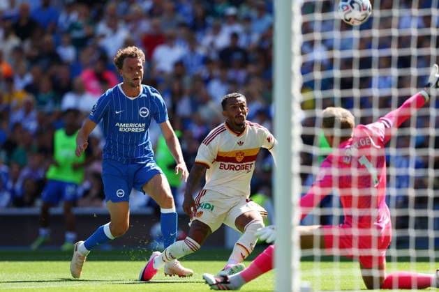 Brighton and Hove, England, 8th August 2026. Wesley of AS Roma has a shot under pressure from Mats Wieffer of Brighton & Hove Albion during the Brighton and Hove Albion vs AS Roma Pre Season Friendly match at the AMEX Stadium, Brighton and Hove. Picture credit should read: Andrew Yates Sportimage EDITORIAL USE ONLY. No use with unauthorised audio, video, data, fixture lists, club league logos or live services. Online in-match use limited to 120 images, no video emulation. No use in betting, games or single club league player publications. SPI_002_PT_Brighton_Roma SPI-4897-0002