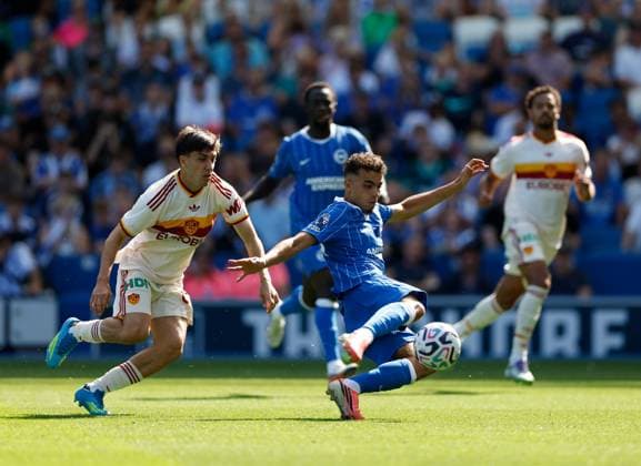 Yasin Ayari shoots to score the 3rd Brighton and Hove Albion goal watched by Mattia Mannini of AS Roma Brighton and Hove Albion v Roma, Pre Season Friendly, Football, American Express Community Stadium, Brighton, UK - 08 Aug 2026Brighton American Express Community Stadi United Kingdom EDITORIAL USE ONLY No use with unauthorised audio, video, data, fixture lists, club league logos or live services. Online in-match use limited to 120 images, no video emulation. No use in betting, games or single club league player publications.  Copyright: xMattxImpey Shutterstockx 17050873l