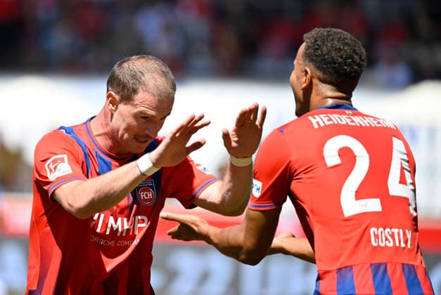 Torjubel vermeintliches TOR zum 2:0 durch Budu Zivzivadze Siwsiwadse 1. FC Heidenheim 1846 FCH (11) kassiert vom VAR, Video-Assistent, Videobeweis, Videoschiedsrichter Video Assistent Referee Marcel Costly 1. FC Heidenheim 1846 FCH (24) 1. FC Heidenheim 1846 FCH vs VfL Osnabrueck 08.08.2026 DFL REGULATIONS PROHIBIT ANY USE OF PHOTOGRAPHS AS IMAGE SEQUENCES AND OR QUASI-VIDEO 1. FC Heidenheim 1846 FCH vs VfL Osnabrueck *** Goal celebration for an alleged 2-0 goal by Budu Zivzivadze Siwsiwadse; 1 FC Heidenheim 1846 (FCH) 11 goal disallowed by VAR, Video Assistant Referee, video review, Video Assistant Referee Marcel Costly, 1 FC Heidenheim 1846 FCH 24, 1 FC Heidenheim 1846 FCH vs. VfL Osnabrück, August 8, 2026. DFL regulations prohibit any use of photOGRAPHS AS IMAGE SEQUENCES AND OR QUASI-VIDEO 1 FC Heidenheim 1846 FCH vs. VfL Osnabrück