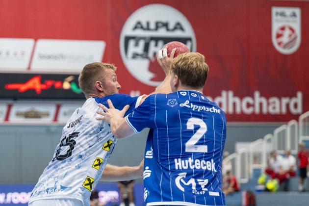HANDBALL - ALPLA Sommercup HARD,AUSTRIA,08.AUG.26 - HANDBALL - ALPLA Sommercup, third place match, HC Hard vs TBV Lemgo Lippe. Image shows Jens Svane Peschardt (Hard) and Lukas Hutecek (Lemgo).  GEPAxpictures xOliverxLerch