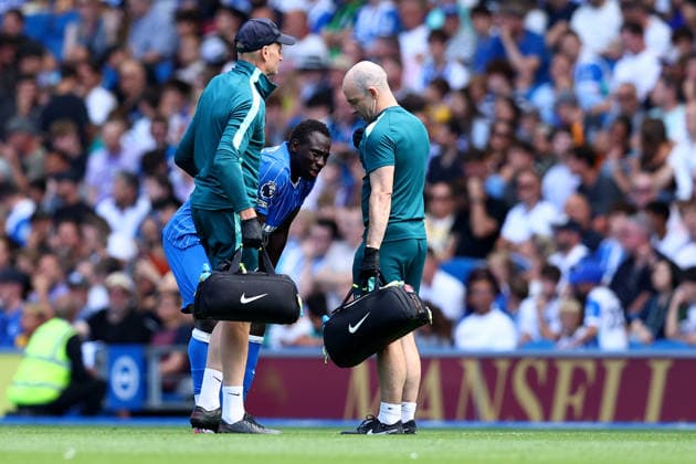 Brighton and Hove, England, 8th August 2026. Yankuba Minteh of Brighton & Hove Albion is helped up by medical staff after receiving medical treatment and then being substituted after picking up an injury during the Brighton and Hove Albion vs AS Roma Pre Season Friendly match at the AMEX Stadium, Brighton and Hove. Picture credit should read: Andrew Yates Sportimage EDITORIAL USE ONLY. No use with unauthorised audio, video, data, fixture lists, club league logos or live services. Online in-match use limited to 120 images, no video emulation. No use in betting, games or single club league player publications. SPI_009_PT_Brighton_Roma SPI-4897-0009