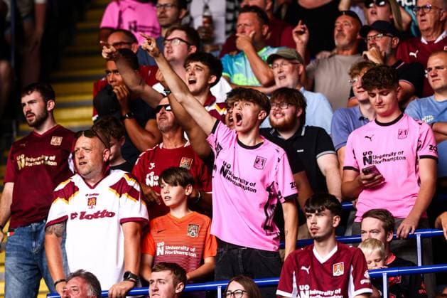 Northampton Town fans sing Leicester City v Northampton Town, EFL Carabao Cup, First Round, Football, King Power Stadium, Leicester, UK - 08 Aug 2026Leicester King Power Stadium United Kingdom EDITORIAL USE ONLY No use with unauthorised audio, video, data, fixture lists, club league logos or live services. Online in-match use limited to 120 images, no video emulation. No use in betting, games or single club league player publications.  Copyright: xMarkxKerton Shutterstockx 17051082cm