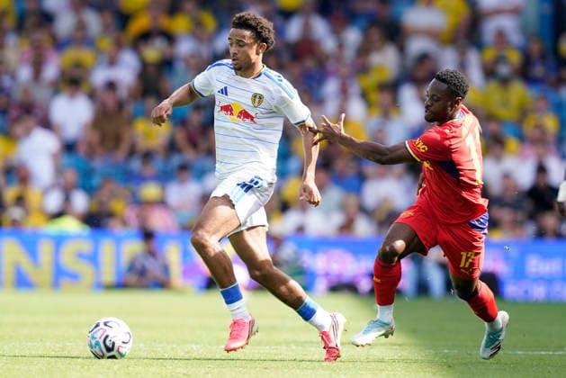 Leeds, England, 8th August 2026. Jayden Lienou of Leeds United (L) is challenged by Ridle Baku of RB Leipzig during the Leeds United vs RB Leipzig Pre Season Friendly match at Elland Road, Leeds. Picture credit should read: Andrew Yates Sportimage EDITORIAL USE ONLY. No use with unauthorised audio, video, data, fixture lists, club league logos or live services. Online in-match use limited to 120 images, no video emulation. No use in betting, games or single club league player publications. SPI_008_AY_LEEDS_LEIPZIG SPI-4898-0008