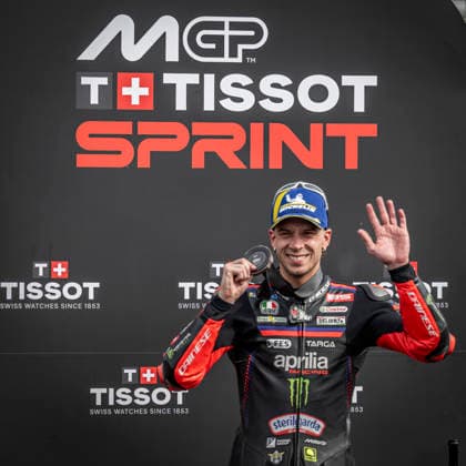 RECORD DATE NOT STATED 8th August 2026; Silverstone Circuit, Northamptonshire, England; 2026 MotoGP Grand Prix of Great Britain, Qualifying Day; Marco Bezzecchi of the Aprilia Racing Team celebrates on the podium after coming third in the Tissot sprint race GodfreyxPitt