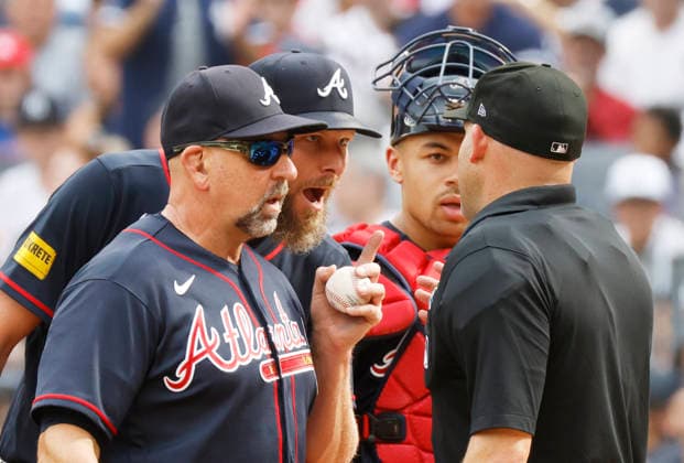 Atlanta Braves manager Walt Weiss argues with umpire Dan Merzel after New York Yankees Spencer Jones scores on a Chris Sale balk in the 5th inning at Yankee Stadium on Saturday, August 8, 2026 in New York City.  NYP20260808111 JOHNxANGELILLO