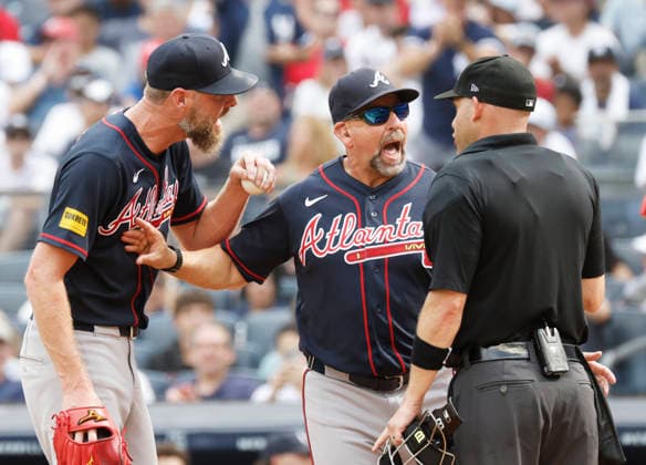 Atlanta Braves manager Walt Weiss argues with umpire Dan Merzel after New York Yankees Spencer Jones scores on a Chris Sale balk in the 5th inning at Yankee Stadium on Saturday, August 8, 2026 in New York City.  NYP20260808110 JOHNxANGELILLO