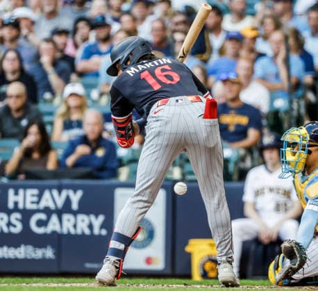 Minnesota Twins left fielder Austin Martin is hit by a pitch thrown by Milwaukee Brewers starting pitcher Shane Drohan in the second inning of the MLB, Baseball Herren, USA game between the Minnesota Twins and the Milwaukee Brewers at American Family Field in Milwaukee, Wisconsin on Saturday, August 8, 2026.  MIL20260808814 TANNENxMAURY