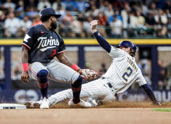Milwaukee Brewers second baseman Brice Turang (R) steals second base on Minnesota Twins shortstop Kaelen Culpepper (L) in the seventh inning of the MLB, Baseball Herren, USA game between the Minnesota Twins and the Milwaukee Brewers at American Family Field in Milwaukee, Wisconsin on Saturday, August 8, 2026.  MIL20260808836 TANNENxMAURY