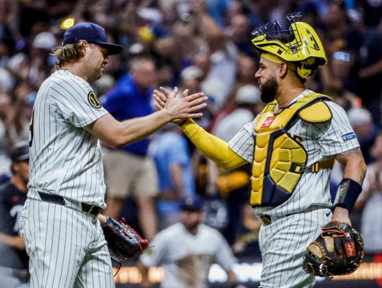 Milwaukee Brewers closing pitcher Trevor Megill (L) and Milwaukee Brewers catcher William Contreras celebrate after the final out in the ninth inning of the MLB, Baseball Herren, USA game between the Minnesota Twins and the Milwaukee Brewers at American Family Field in Milwaukee, Wisconsin on Saturday, August 8, 2026. The Brewers defeated the Twins 4-3.  MIL20250808845 TANNENxMAURY