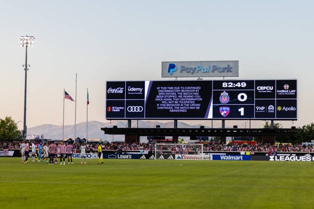 SAN JOSE, CA - AUGUST 08: The video board displays a message that play has been stop due to discriminatory behavior by fans during a Leagues Cup Phase One match between Chivas de Guadalajara and FC Dallas on August 8, 2026 at PayPal Park in San Jose, CA. (Photo by Matthew Huang Icon Sportswire) SOCCER: AUG 08 Leagues Cup Chivas de Guadalajara vs Dallas EDITORIAL USE ONLY Icon260808017
