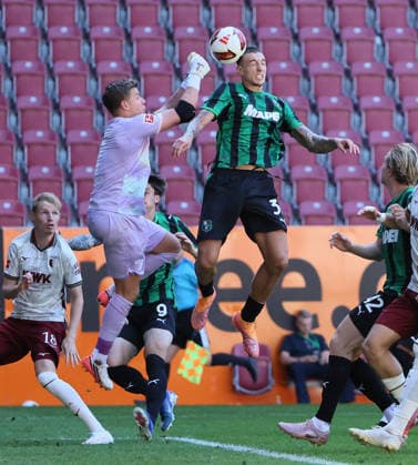 (260809) -- AUGSBURG, Aug. 9, 2026 -- Finn Dahmen (L, top), goalkeeper of FC Augsburg, makes a save during the friendly football match between FC Augsburg and Sassuolo in Augsburg, Germany, Aug. 8, 2026. (Photo by Xinhua) (SP)GERMANY-AUGSBURG-FOOTBALL-FRIENDLY MATCH-AUGSBURG VS SASSUOLO PhilippexRuiz 