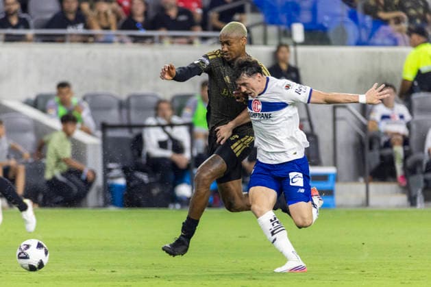 August 8, 2026, Los Angeles, California, USA: Los Angeles FC defender Nkosi Tafari Burgess (91) and Toluca FC forward Federico SebastioÂ¡n VioÂ±as Barboza (16) vie for the ball during a Leagues Club soccer match on Saturday, Aug. 8, 2026 in Los Angeles. Los Angeles USA - ZUMAc68_ 20260808_zaf_c68_014 Copyright: xRingoxChiux