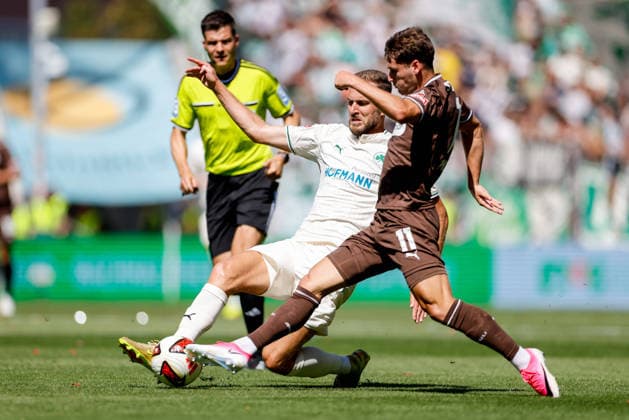 Hamburg, 9. August 2026 - Fußball, 2. Bundesliga 2026 27, FC St. Pauli - SpVgg Greuther Fürth: Dennis Srbeny (SpVgg Greuther Fürth, 7), Arkadiusz Pyrka (FC St. Pauli, 11) DFL REGULATIONS PROHIBIT ANY USE OF PHOTOGRAPHS AS IMAGE SEQUENCES AND OR QUASI-VIDEO. *** Hamburg, August 9, 2026 Soccer, 2026–27 2. Bundesliga, FC St. Pauli vs. SpVgg Greuther Fürth; Dennis Srbeny (SpVgg Greuther Fürth), 7; Arkadiusz Pyrka (FC St. Pauli), 11. DFL regulations prohibit any use of photographs as image sequences and or quasi-video.