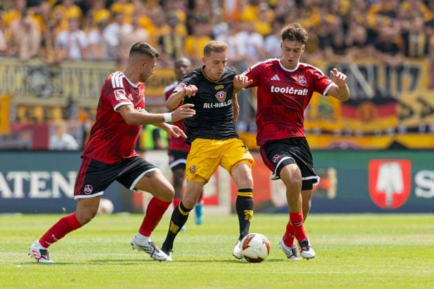 v.l.n.r.: Alexios Kalogeropoulos (1. FC Nürnberg), Niklas Hauptmann (Dynamo Dresden) und Javier Fernandez (1. FC Nürnberg), im 2. Bundesliga-Spiel zwischen dem 1. FC Nürnberg und Dynamo Dresden im Max-Morlock-Stadion, Nürnberg, Deutschland, am 9. August 2026. in action during the 2nd Bundesliga match between 1. FC Nuremberg and Dynamo Dresden at the Max-Morlock Stadium, Nuremberg, Germany, on August 9, 2026. DFB DFL REGULATIONS PROHIBIT ANY USE OF PHOTOGRAPHS AS IMAGE SEQUENCES AND OR QUASI-VIDEO, *** From left to right: Alexios Kalogeropoulos of 1. FC Nuremberg, Niklas Hauptmann of Dynamo Dresden, and Javier Fernandez of 1. FC Nuremberg, in the 2. Bundesliga match between 1. FC Nuremberg and Dynamo Dresden at the Max Morlock Stadium, Nuremberg, Germany, on August 9, 2026, in action during the 2nd Bundesliga match between 1 FC Nuremberg and Dynamo Dresden at the Max Morlock Stadium, Nuremberg, Germany, on August 9, 2026. DFB and DFL regulations prohibit any use of photographs as image sequences and or quasi-video, Copyright: HMBxMedia xHeikoxBecker