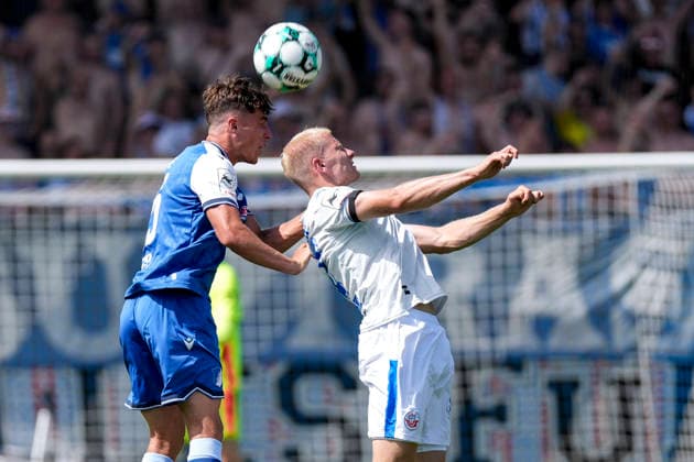 v.li.: Matthew Moore (TSG II, 15), Milosz Brzozowski (Rostock, 37), beim Kopfball, Kopfballduell, Spielszene, Zweikampf in der Luft, Aktion, Action, 09.08.2026, Sinsheim (Deutschland), Fussball, 3. Liga, TSG 1899 Hoffenheim II - Hansa Rostock, DFB DFL REGULATIONS PROHIBIT ANY USE OF PHOTOGRAPHS AS IMAGE SEQUENCES AND OR QUASI-VIDEO. *** From left: Matthew Moore (TSG II), 15, Milosz Brzozowski (Rostock), 37, during a header, header duel, game scene, aerial duel, action, 09 08 2026, Sinsheim, Germany, soccer, 3rd Division, TSG 1899 Hoffenheim II vs. Hansa Rostock, DFB and DFL regulations prohibit any use of photographs as image sequences and or quasi-video xozx