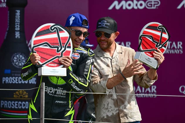 motor racing, Motorsport Moto GP Qatar Airways Grand Prix of Great Britain Superfile Trackhouse MotoGP Team rider Raul Fernandez (25) and team owner Justin Marks with their winners and constructors trophies on the podium during the Moto GP Qatar Airways Grand Prix of Great Britain at Silverstone, Towcester, UK on 9 August 2026. Towcester Silverstone Northamptonshire UK Editorial use only , Copyright: xDennisxGoodwinx PSI-24671-0039
