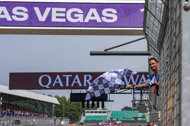 Benjamin (Ben) Whittaker (Professional Boxer), waves the chequered flag to end the MotoGP Race at Round 12 of the 2026 Qatar Airways Grand Prix of Great Britain at Silverstone Circuit, Towcester, England on the 9 August 2026.  Copyright: xDavidxHornx PMI-7310-0287