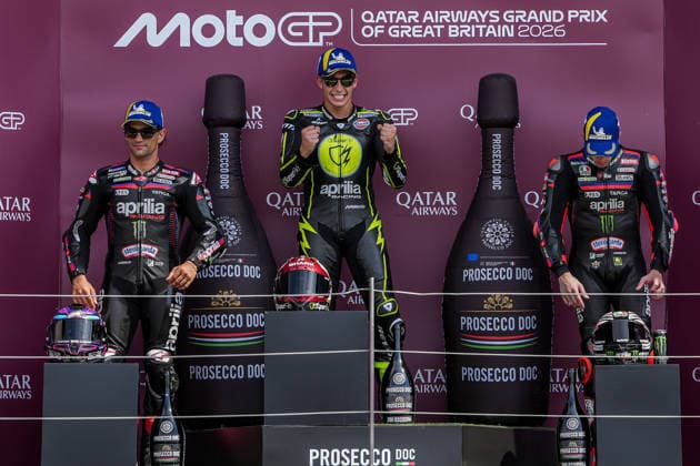 Jorge Martin (Spain) of the Aprilia Racing ( 89) (2nd), Raul Fernandez (Spain) of the SuperFile Trackhouse MotoGP Team ( 25) (1st) and Marco Bezzecchi (Italy) of the Aprilia Racing ( 72) (3rd) on the podium after the MotoGP Race at Round 12 of the 2026 Qatar Airways Grand Prix of Great Britain at Silverstone Circuit, Towcester, England on the 9 August 2026.  Copyright: xDavidxHornx PMI-7310-0289