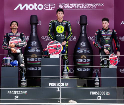Jorge Martin (Spain) of the Aprilia Racing ( 89) (2nd), Raul Fernandez (Spain) of the SuperFile Trackhouse MotoGP Team ( 25) (1st) and Marco Bezzecchi (Italy) of the Aprilia Racing ( 72) (3rd) on the podium after the MotoGP Race at Round 12 of the 2026 Qatar Airways Grand Prix of Great Britain at Silverstone Circuit, Towcester, England on the 9 August 2026.  Copyright: xDavidxHornx PMI-7310-0291